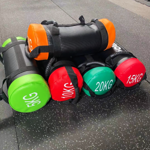 Gym Equipment- 5 neatly stacked Power Bags of weights: 5KG,10KG,15KG,20KG,25KG on gym floor