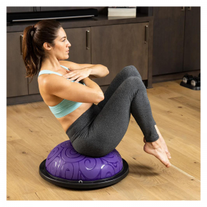 Strength Training Equipment- (300*300)- Woman using the Purple Bosu Ball to perform a seated oblique twist