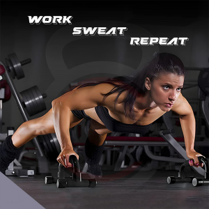 Strength Training Equipment- (300*300)- Woman performing a push up using a pair of Push Up stands in gym setting: The text "Work" "Sweat" "Repeat" can be seen above