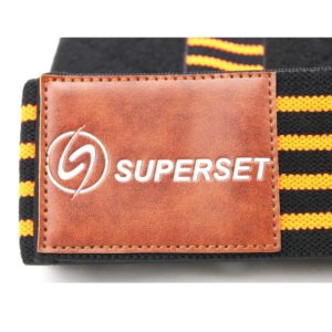 Weight Lifting Gear- (300*300) image- Black and Yellow striped Superset Elbow support strap with logo in focus