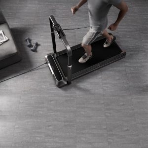 Rent Gym Equipment- Top view of the WalkingPad R2 Pro Treadmill with man using it in home setting