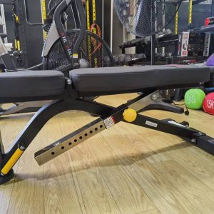 Strength Training Equipment- (Flat/Incline/Decline) Weight Bench DB-1003 in flat position shown in a gym setting