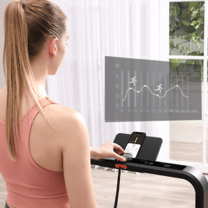 Cardio Equipment- Woman adjusting the dial of the WalkingPad x21 treadmill along with a rectangular holographic overlay with a graph showing various workout intenstities plotted on a chart along with 2 white stick-vector images of running humans