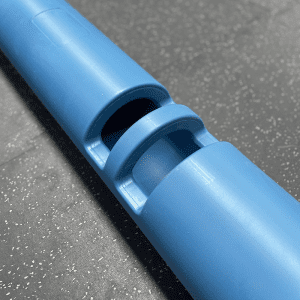 Gym Equipment- (300*300)- Close view of the handle area of the 12KG Light-Blue Colour VIPR Natural Rubber Weight Fitness Barrel on gym floor