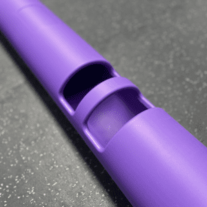 Gym Equipment- (300*300)- Close view of the handle area of the 4KG Purple Colour VIPR Natural Rubber Weight Fitness Barrel on gym floor