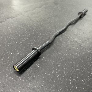 Strength Training Equipment- Profile view of the 9.5KG Black Olympic Curl Bar on gym floor