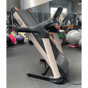 Cardio Equipment- (300*300) image- Profile View of the Light Commercial Motorized Treadmill DB-2006 in folded position in a gym setting