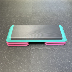 Cardio Equipment- Adjustable Aerobic Studio Stepper (Black/Green/Pink) (2 Levels attached) on gym floor