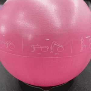 Yoga Product- (300*300)- Close view of the Premium Swiss Ball (Pink) with 3 exercise llustrations visble on product