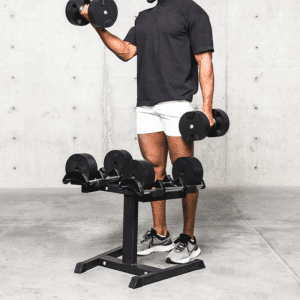 A man lifting dumbbell from dumbbell rack