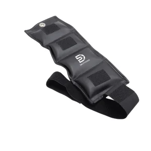 DB Fitness adjustable ankle weight strap with padded segmented design and secure hook-and-loop fastening on a white background
