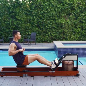DB Fitness water rower in use, ideal for a home gym or compact space as a fold rower.